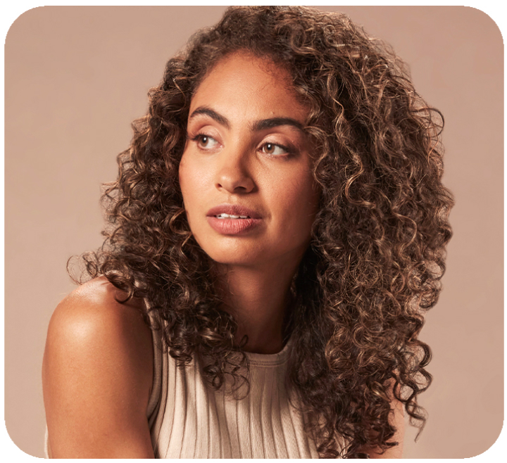 Woman with long, curly hair.