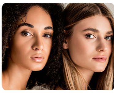 Close-up of three women with curly, wavy, and straight hair.