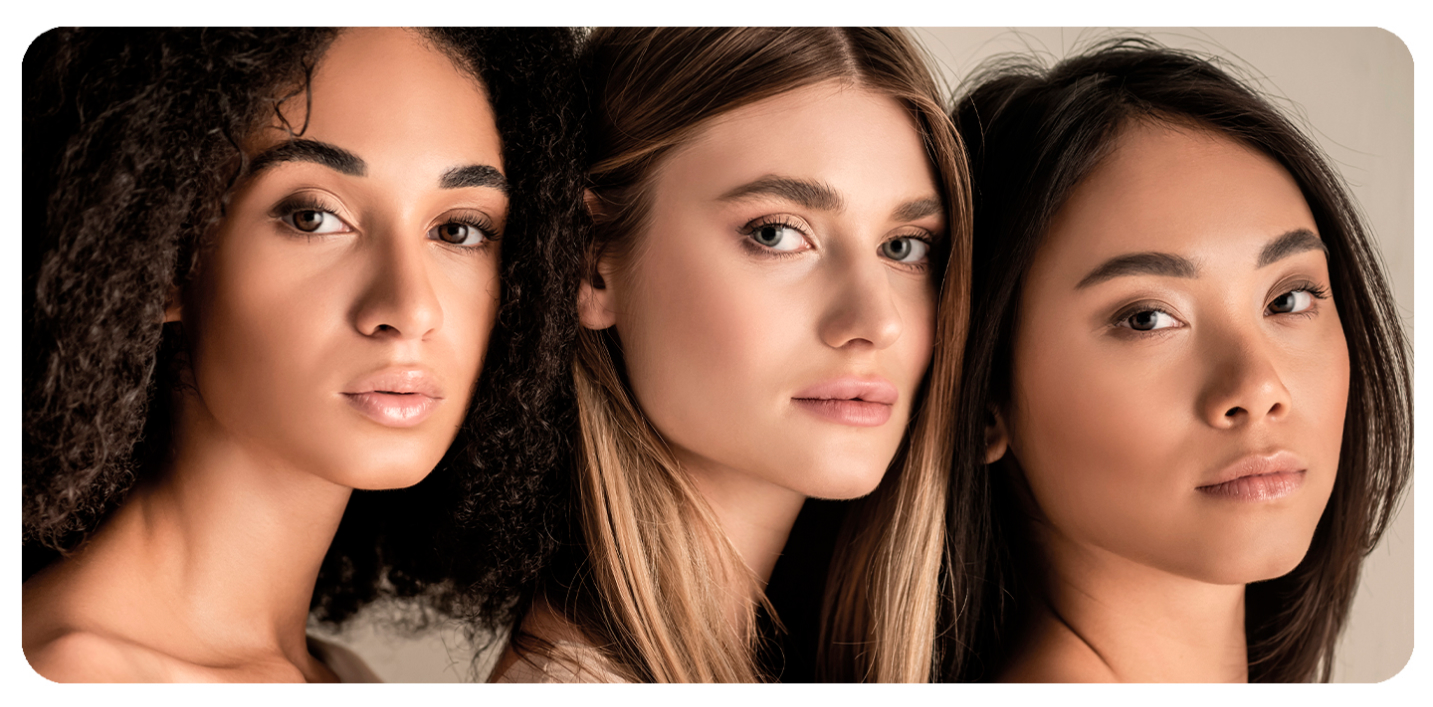 Close-up of three women with curly, wavy, and straight hair.